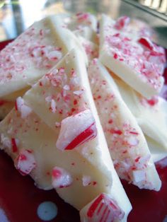 pieces of white chocolate with candy canes on a red and white polka dot plate