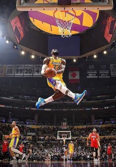 a basketball player jumping up into the air