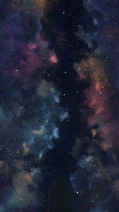 the night sky is filled with stars and clouds, as if it were in outer space