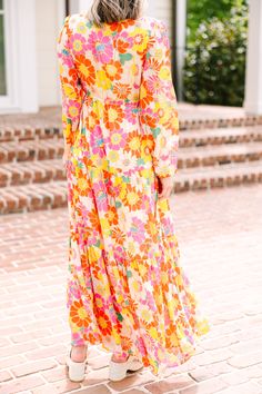 This long-sleeve maxi dress is stunning with its bright, colorful floral print! The elastic waist offers a flattering silhouette, accentuating your figure while offering a comfortable fit. Whether it's fancy brunch with the girls or a romantic dinner, this dress brings a touch of elegance to any occasion. This maxi dress features long bubble sleeves, a v-neck, side slit, elastic waist, and a bold floral print. Material has no amount of stretch.Cam is wearing the small. Fancy Brunch, Yellow Floral Maxi Dress, Maxi Dres, Bold Floral Print, Mint Julep Boutique, Romantic Dinner, Long Sleeve Maxi, Model Fits, Floral Maxi