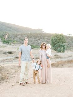 a family poses for a photo in the desert