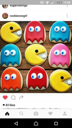 decorated cookies are arranged in the shape of pacman faces