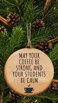 a wooden ornament that says may your coffee be strong and your students be calm