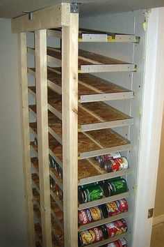 the shelves are made out of wood and have canned food in them