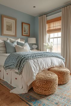 a large bed sitting in a bedroom next to two baskets on top of a rug