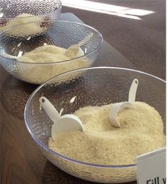 two bowls filled with food on top of a table