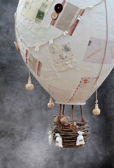 a white hot air balloon with lots of tags attached to it