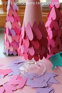 pink and purple paper trees are on the table