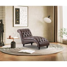 a brown leather chaise lounge chair sitting on top of a rug in a living room