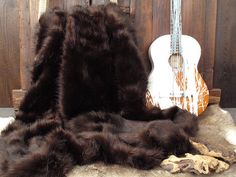 a guitar and some fur on the ground