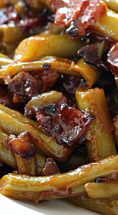 close up view of french fries with bacon and ketchup