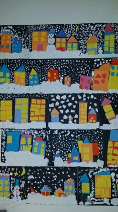 an art project with paper houses and snow