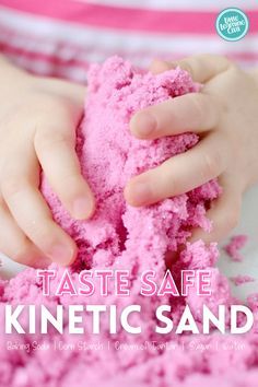 a child is playing with pink sand in their hands and the text reads, taste safe kinetic sand