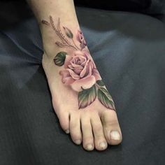 a person with a rose tattoo on their foot