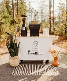 the dwelling coffee cart is set up outside