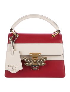 #GUCCI | From Recent Collection. Crimson and creme leather Gucci Small Queen Margaret Top Handle Bag with antiqued gold-tone hardware, single rolled top handle, single detachable striped canvas shoulder strap, light blush suede interior lining, three compartments at interior, dual pockets at interior wall; one with zip closure and push-lock closure at front with embellished bee accent. Includes dust bag. Shop Gucci designer bags online at The RealReal. Queen Margaret, Gucci Designer, Online Bags, Handle Bag, Designer Bags, Antique Gold, Gucci Bag