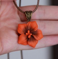 Burnt orange statement necklace Hibiscus necklace pendant | Etsy Unique Orange Flower Shaped Jewelry, Unique Orange Flower-shaped Jewelry, Handmade Orange Necklace With Flower Pendant, Handmade Orange Resin Necklace, Handmade Orange Flower Pendant Necklace, Handmade Clay Flower Jewelry, Orange Clay Jewelry For Gifts, Handmade Orange Flower-shaped Jewelry, Handmade Orange Flower Necklace