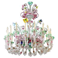 a chandelier with many colorful glass pieces hanging from it