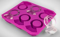 an ice tray with several pieces of plastic in it