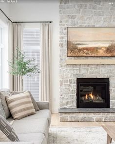 a living room filled with furniture and a fire place