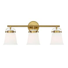 three light bathroom fixture in an antique brass finish with frosted glass shades on the sides