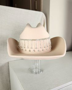 Stand out from the herd with our Glam Cowgirl Hat, featuring rhinestone fringe for a touch of bling. Perfect for rodeos, festivals, country concerts, or just everyday wear. Don't be a plain Jane, grab your glam cowgirl hat today! Cheap Pink Western Hat Bands, Western Hats With Bling For Rodeo, Western Bling Hat For Rodeo, Western Style Bling Hats For Rodeo, Western Style Hat With Bling And Curved Brim, Brimmed Hats With Rhinestones For Country Events, Country Style Rhinestone Hats For Rodeo, Adjustable Rhinestone Hat Bands For Western-themed Events, Festival Fedora Hats With Rhinestones