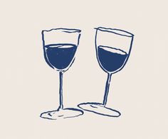 two glasses of wine sitting next to each other