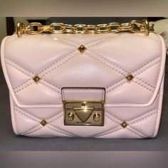 Rare Nwt Small Mk Studded Serena Crossbody Make An Offer Features : Gold Chain That Is Adjustable Allowing You To Wear It As A Crossbody Or Shoulder Bag , Inner Slip Pockets, Push Lock Closure, And Outer Slip Pocket Material: Smooth Vegan Faux Leather Measurements: 7”W X 5”H X 3”D Color : Powder Blush Msrp: $548 Luxury Bag ,Designer Bag, Party Bag, Everyday Bag, Feminine, Cute Bag, Classy Bag , Crossbody, Shoulder Bag #Barbiecore #Barbiegirl #Barbie #Designerbag #Mk #Studded #Pink Sac Michael Kors, Mk Purse, Book Bags, Brown Crossbody Bag, Pink Crossbody Bag, Michael Kors Crossbody Bag, Girly Bags, Michael Kors Outlet, Quilted Crossbody Bag