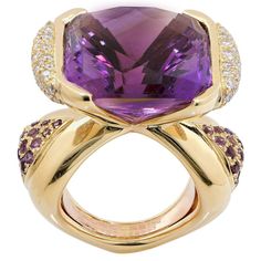 For Sale on 1stdibs - This wonderful design by Mauboussin, Paris features a modified cushion cut Amethyst which weighs approximately 20 carats and is flanked by triangular shaped Luxury Octagon Evening Jewelry, Luxury Octagon Ring With Gemstone Accents, Luxury White Gold Amethyst Ring With Gemstone Accents, Luxury Purple Diamond Ring For Formal Occasions, Luxury Octagon Diamond Ring With Accent Stones, Luxury White Gold Amethyst Ring With Diamond, Luxury Yellow Gold Amethyst Ring With Gemstone Accents, Luxury Yellow Gold Amethyst Ring With Polished Finish, Luxury White Gold Amethyst Ring