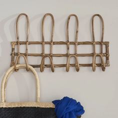 a handbag hanging on a wall next to a purse