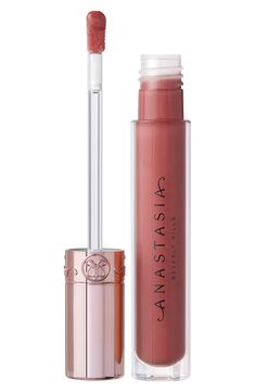 What it is: A nonsticky, comfortable lip gloss with a glass-like finish that makes your lips look instantly fuller and smoother. What it does: Its flat, paddle-shaped applicator glides on with ease and precision, delivering the perfect amount of gloss. Weightless and nonsticky, the lip gloss can be worn on its own or layered with liner and lipstick for extra dimension. How to use: Apply to the center of your top and bottom lip. Use the tip of the applicator to shape the lip line with precision. Lip Liner And Lipstick, Lip Line, Bottom Lip, How To Line Lips, Alcohol Free, Anastasia Beverly Hills, Lip Liner, Dusty Rose, Oil Free