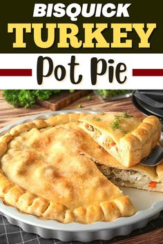 a turkey pot pie on a white plate with the words, biscuit turkey pot pie