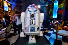 a star wars r2d2 robot on display in a restaurant