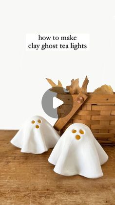 two ghost - like objects sitting on top of a wooden table