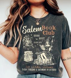 Retro Salem Book Club Shirt, Bookish Halloween Tee,Black Cat Spooky Book Lover Shirt, Salem Witches, Spooky Season Fall Bookish Things Shirt ABOUT MATERIAL: Comfort Colors® 1717 Made with medium fabric (6.1 oz/yd² (206.8 g/m consiting of high quality, 100% ring-spun US cotton for long-lasting comfort. The relaxed fit keeps the wearer comfy in both casual and semi-formal settings while the crew neckline delivers that classic, neat style which makes it perfect for accessorizing. What's more, the p Black Bookish Top With Letter Print, Black Letter Print Top For Bookish Style, Black Cat Spooky, Salem Witches, Bookish Halloween, Book Club Shirt, Bookish Things, Autumn Outfits, Club Shirts