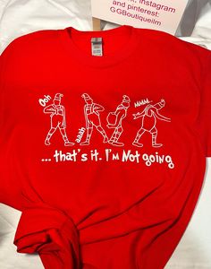 a red t - shirt with the words that's it'm not giving on it