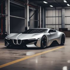 a silver sports car parked in a garage