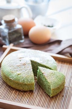 there is a cake that has been cut in half on a tray with other ingredients