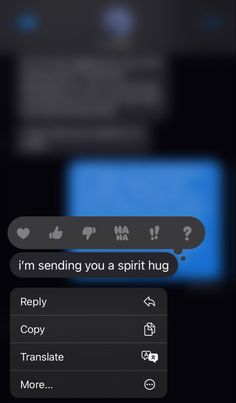 the text message is being displayed on the cell phone's screen, and it appears to be sending you a spirit hug