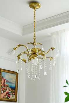 Enhance your home decor with our elegant Prosecco Chandelier. With its pleasing design and brass finish, this chandelier adds an eye-catching touch of richness and depth to any room. Featuring 3 lights and accented with lead crystal droplets, it brilliantly reflects the light of candle bulbs.