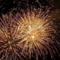 fireworks are lit up in the night sky