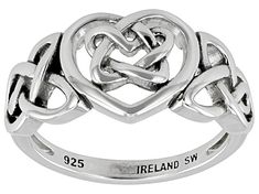 a silver ring with two intertwined hearts