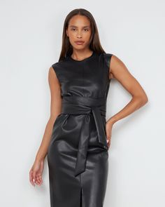 A sleek and modernized take on the LBD — this vegan leather dress is perfect for the office layered over a long-sleeve tee or on its own for date night. See below for our general Size Guide and available measurements Made of polyester, lining made of polyester Machine wash cold separately, tumble dry at low temperature, cool iron as needed Tie Front Dress, Faux Leather Dress, Black Xs, Leather Dress, The Office, Date Night, Size Guide, Vegan Leather, Long Sleeve Tees