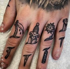 a person's hand with tattoos on it