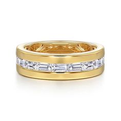 a yellow gold wedding band with baguettes and diamonds