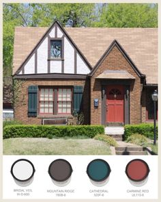 the exterior of a house with red doors and green shutters, including two windows