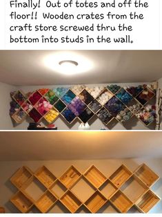 the wall is made out of wooden crates and has pictures on it with different colors