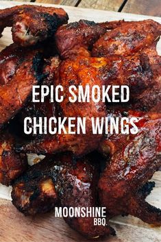 some chicken wings on a cutting board with the words epic smoked chicken wings