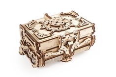 an intricately carved wooden box is shown on a white background with no people around it