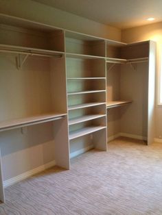 an empty room with some shelves in it